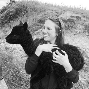 Genevieve holding baby alpaca