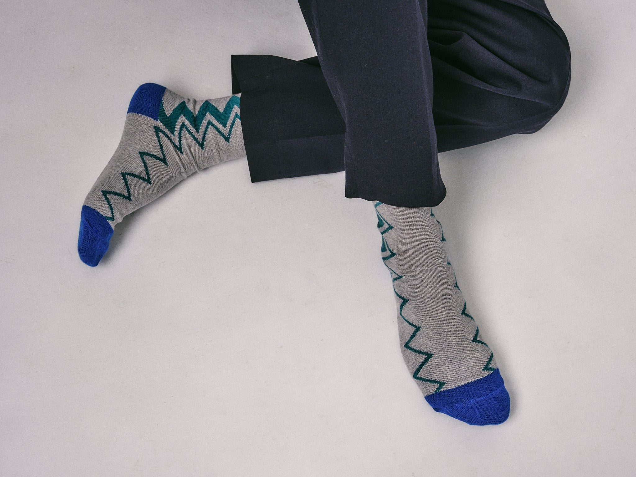 mens dark blue trousers styled with the Sigi Organic Cotton Zig Zag Socks in Grey and Blue