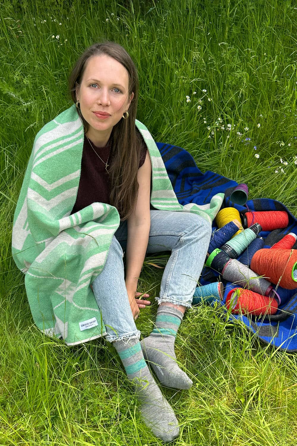 Genevieve Sweeney in the Geometric Lambswool Oversized Scarf Green
