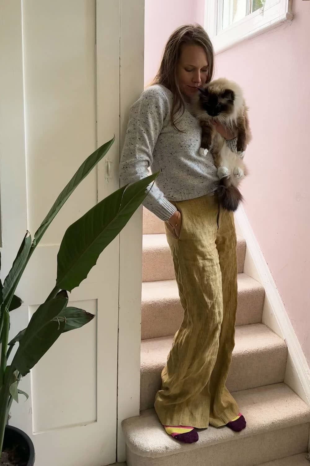 Genevieve Sweeney in the Maud Sweater Tweed Light Grey with her cat