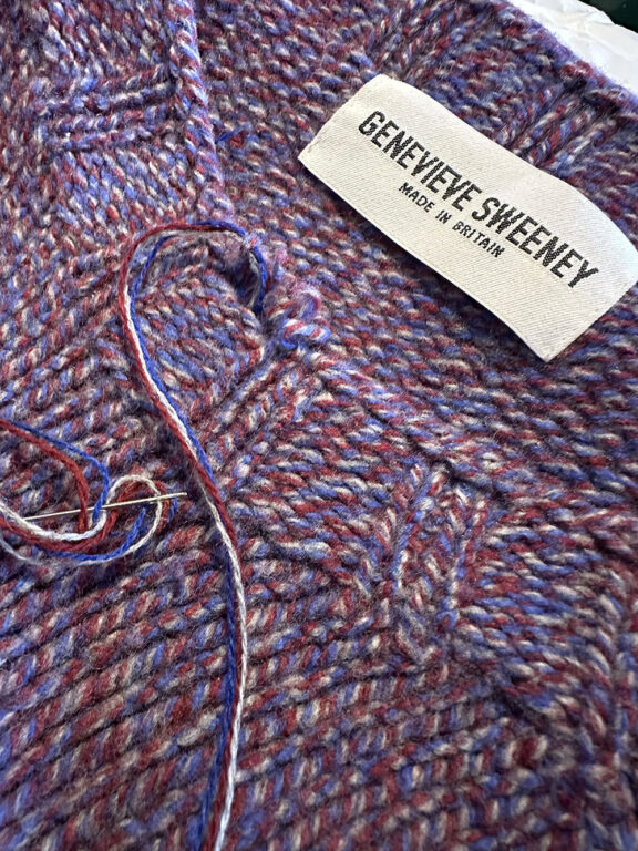 Close up repair of a Genevieve Sweeney Sweater